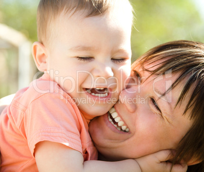 Portrait of a mother hugging her son