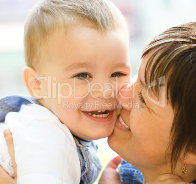 Portrait of a mother hugging her son