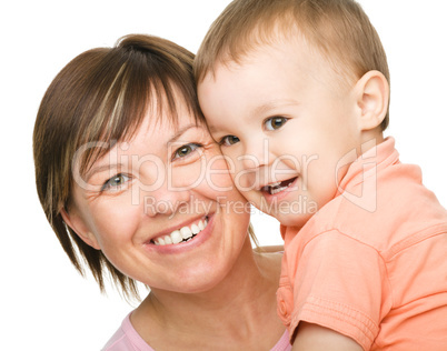 Portrait of a happy mother hugging her son