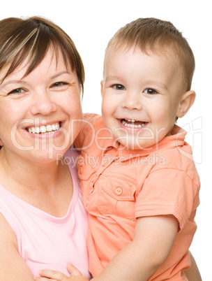 Portrait of a happy mother hugging her son