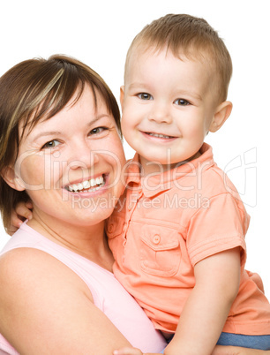 Portrait of a happy mother hugging her son