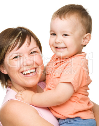 Portrait of a happy mother hugging her son