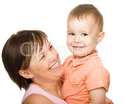 Portrait of a happy mother hugging her son