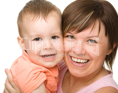 Portrait of a mother hugging her son