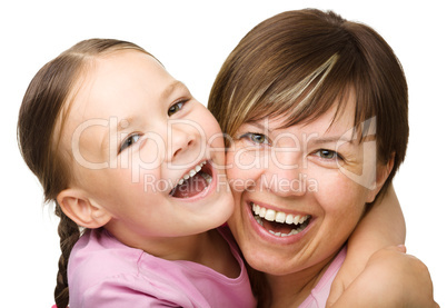 Portrait of a happy mother hugging her daughter