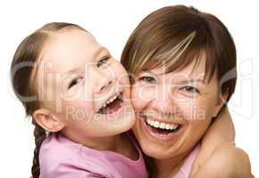 Portrait of a happy mother hugging her daughter