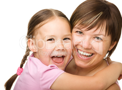 Portrait of a happy mother hugging her daughter