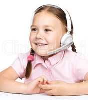 Young girl is working as an operator at helpline