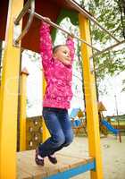 Cute little girl is playing in playground