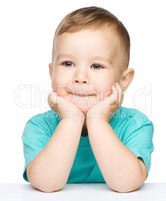 Portrait of a cute little boy looking at something
