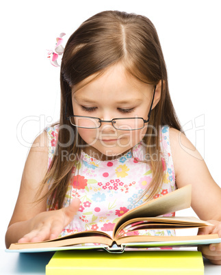 Cute little girl with book