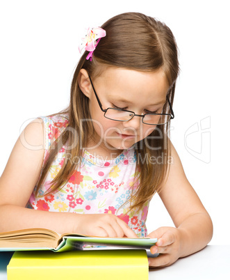 Cute little girl with book