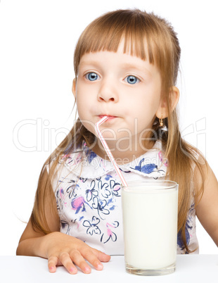 Cute little boy with a glass of milk