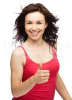 Woman is showing thumb up gesture