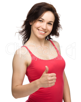 Woman is showing thumb up gesture