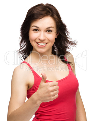 Woman is showing thumb up gesture