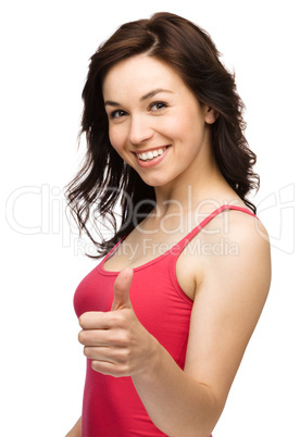 Woman is showing thumb up gesture