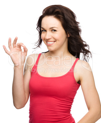 Woman is showing OK sign