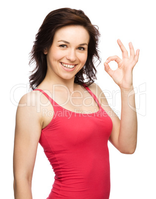 Woman is showing OK sign