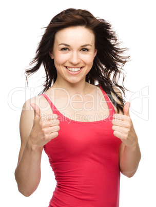 Woman is showing thumb up gesture