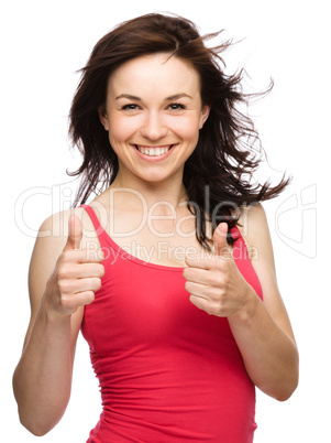 Woman is showing thumb up gesture