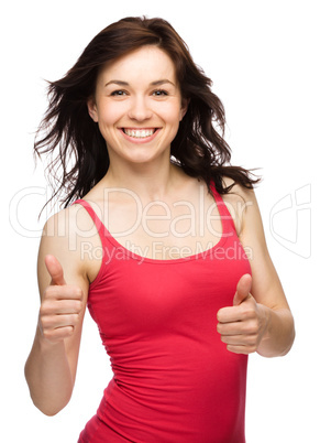 Woman is showing thumb up gesture