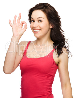 Woman is showing OK sign