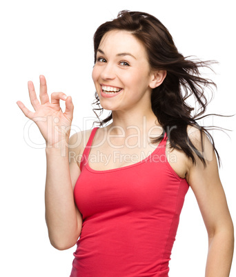 Woman is showing OK sign