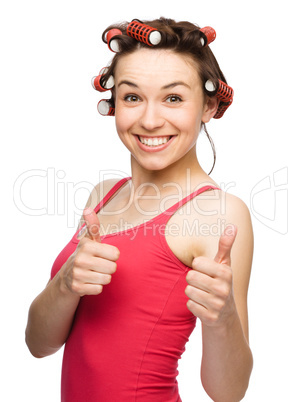 Woman is showing thumb up gesture