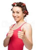 Woman is showing thumb up gesture