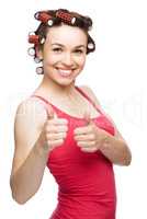 Woman is showing thumb up gesture