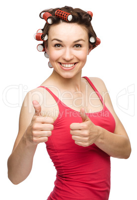 Woman is showing thumb up gesture