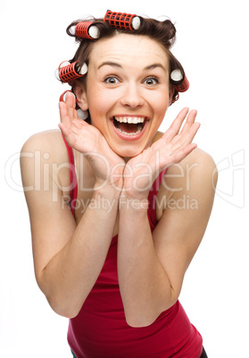 Woman is holding her face in astonishment