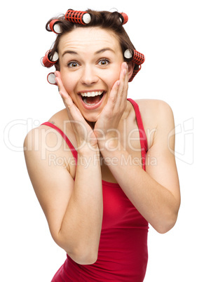 Woman is holding her face in astonishment