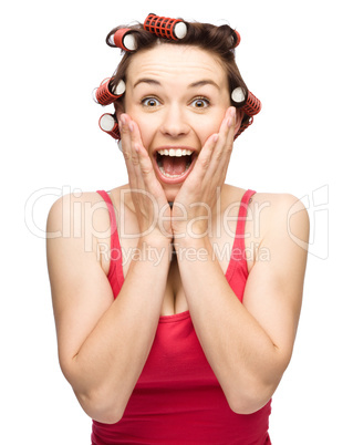 Woman is holding her face in astonishment