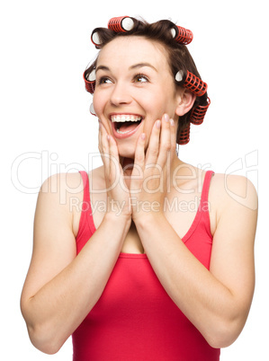 Woman is holding her face in astonishment