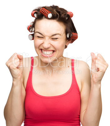 Woman is screaming holding her fists tight