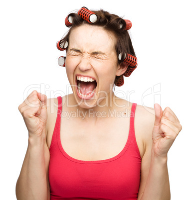 Woman is screaming holding her fists tight