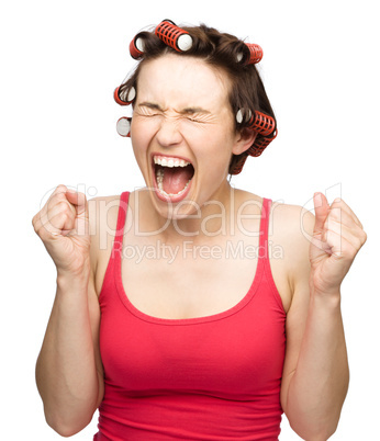 Woman is screaming holding her fists tight