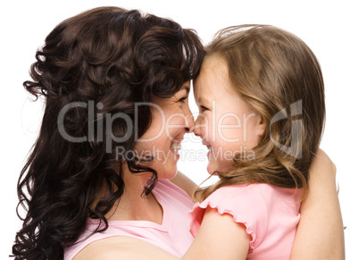 Portrait of happy daughter smiling at her mother