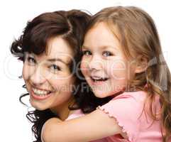 Portrait of happy daughter with her mother