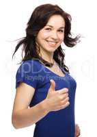 Woman is showing thumb up gesture