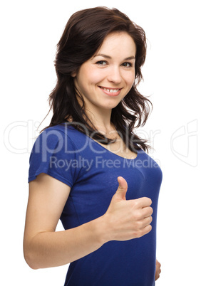 Woman is showing thumb up gesture