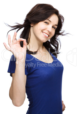 Woman is showing OK sign