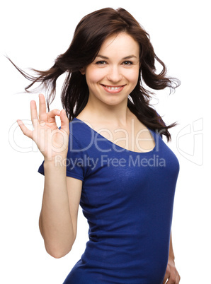 Woman is showing OK sign