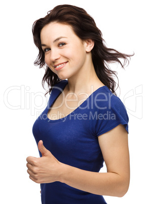 Woman is showing thumb up gesture