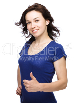 Woman is showing thumb up gesture