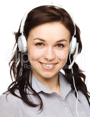 Lovely young woman is talking to customers