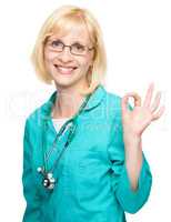 Woman doctor showing OK sign