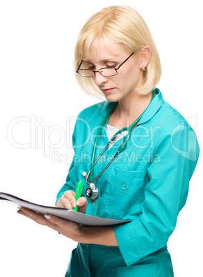 Portrait of a woman wearing doctor uniform